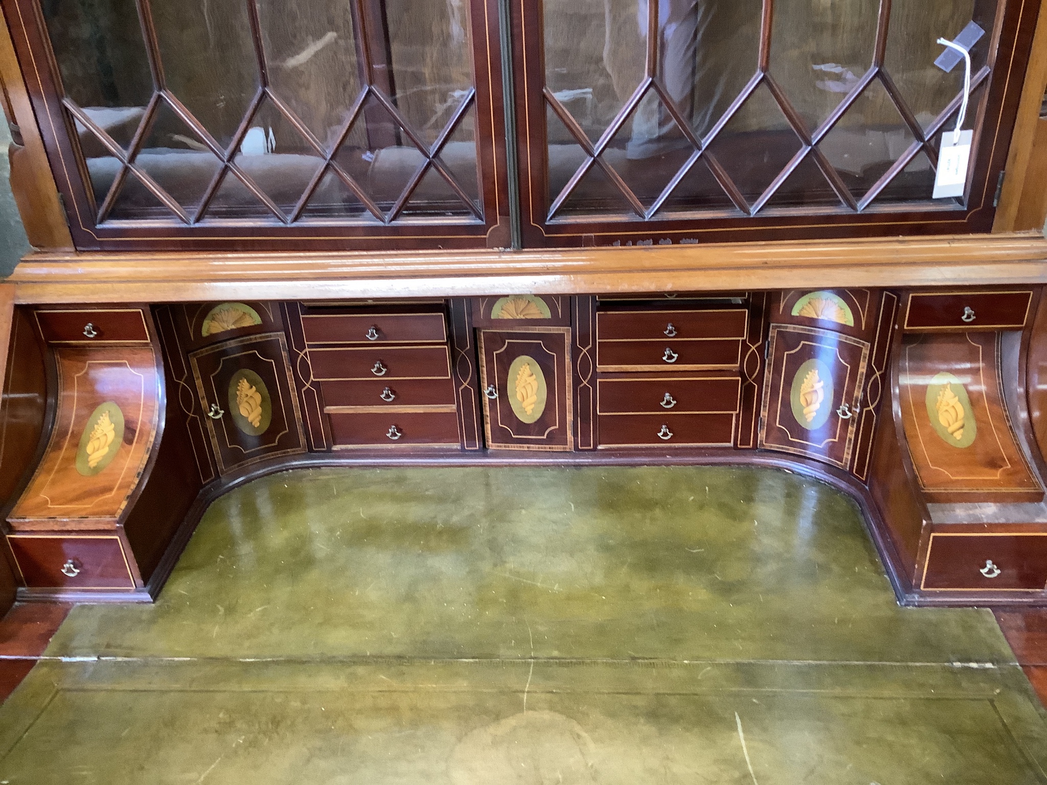 A good quality George III style inlaid and cross banded flamed mahogany bureau bookcase, width 132cm, depth 58cm, height 278cm.